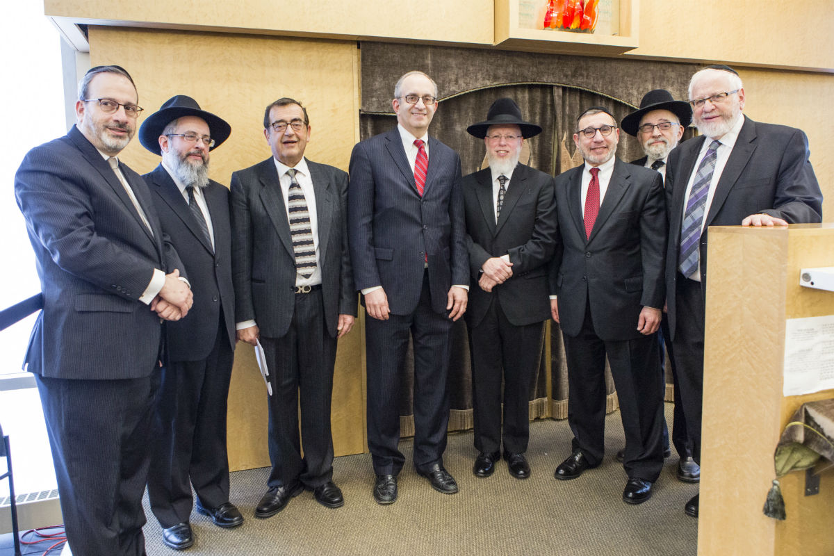 L-r: Rabbi Moshe D. Krupka; Rabbi Doniel Lander; Zvi Ryzman; Dr. Alan Kadish; Rabbi Yonason Sacks; Dr. Moshe Sokol; Dr. Stanley L. Boylan; and Rabbi Yehuda Shmulewitz.