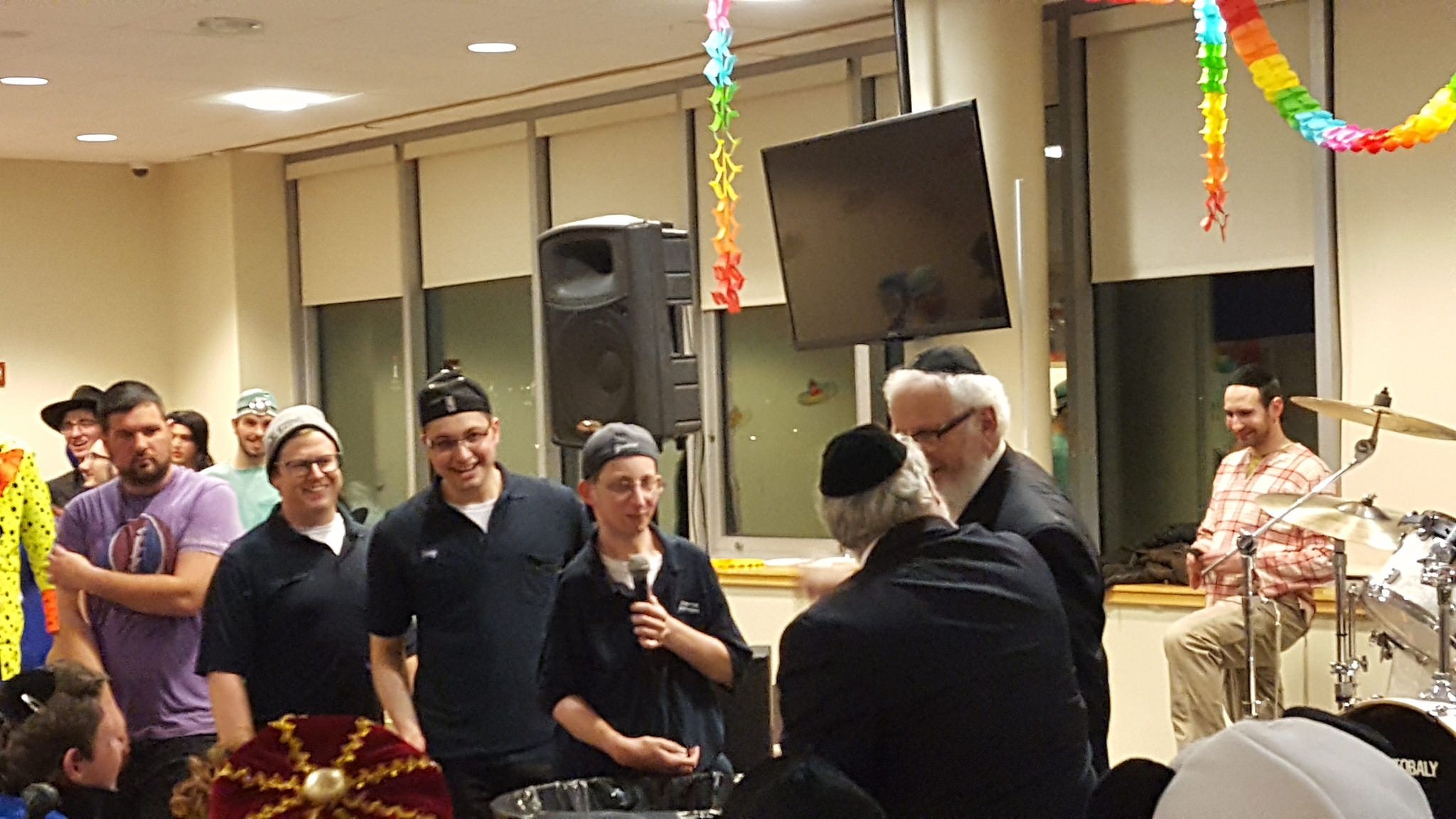 Purim Costume contest winners were Yaakov Burack, Michael Sher, and Netanel Lederer, who dressed as the Lander College for Men cleaning crew.