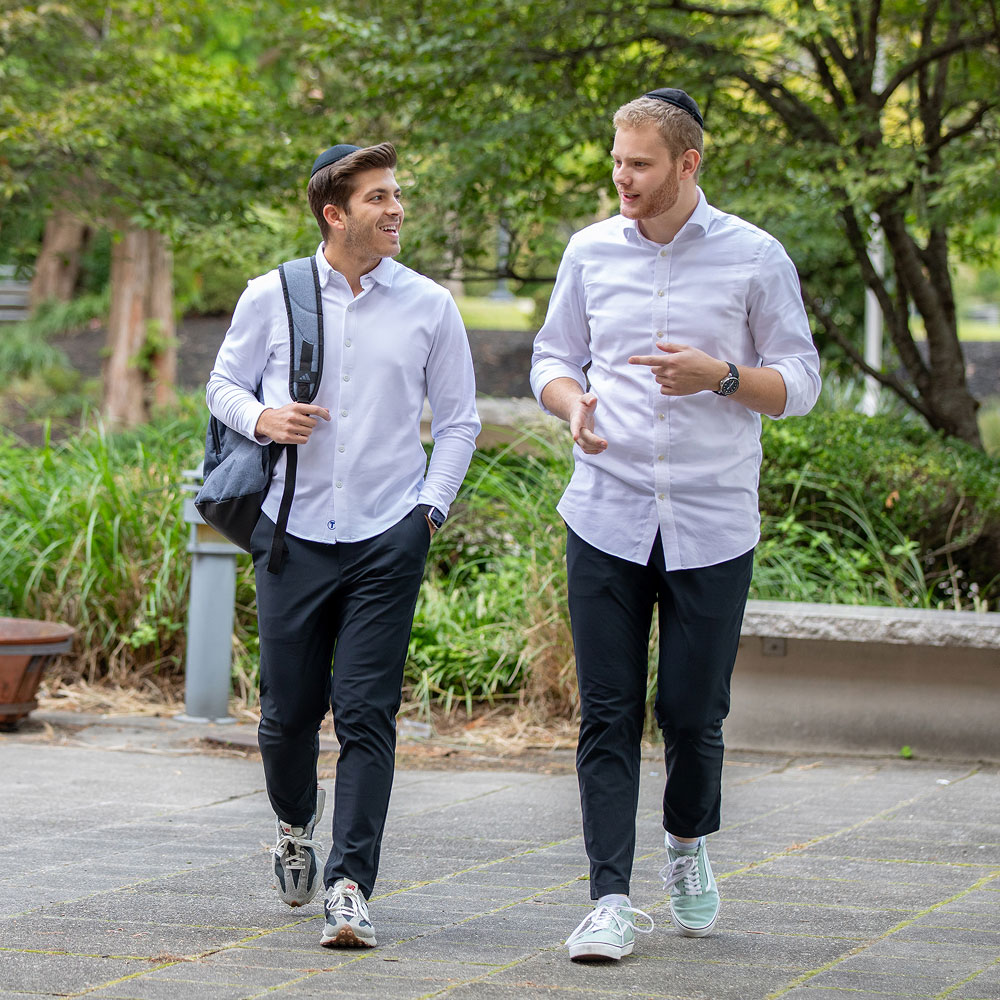 two students walking outside of class
