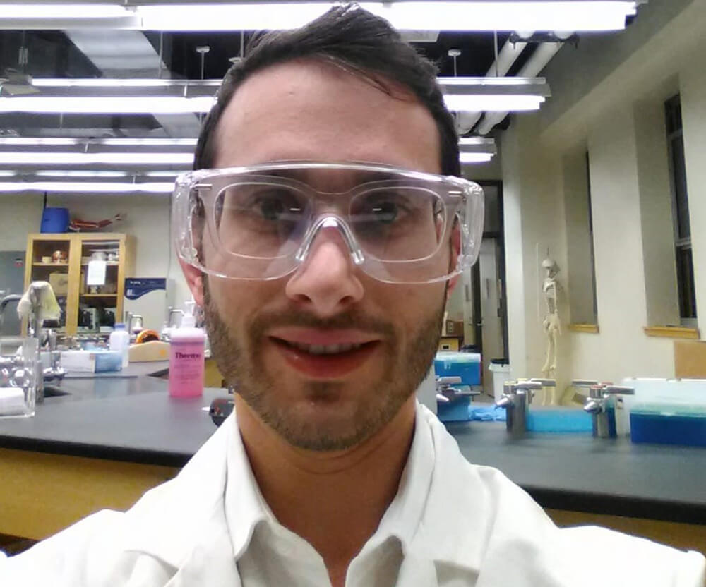 zvi goldman in lab goggle in the Lander College for Men lab
