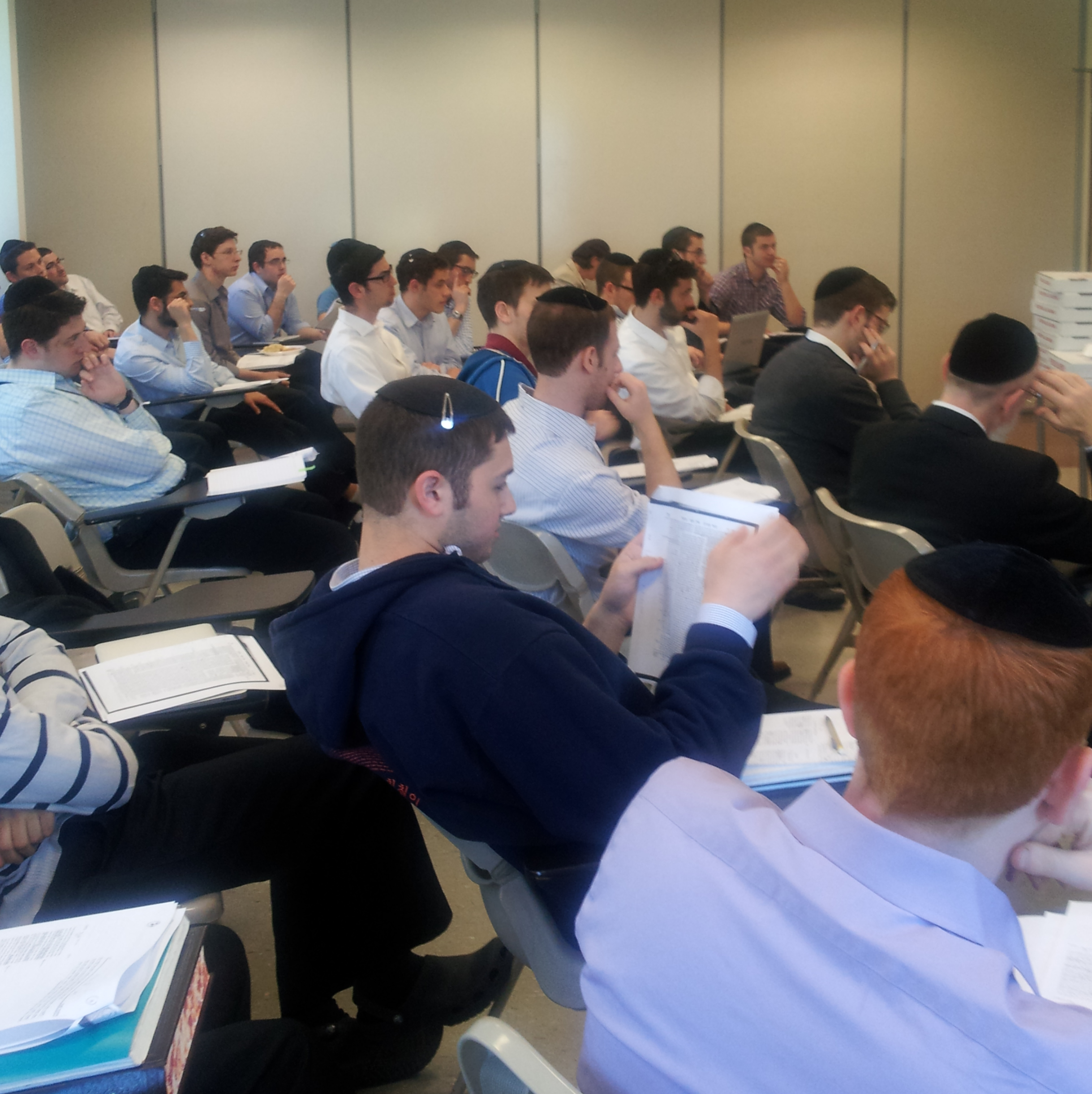 Rabbi Dr. Howard Apfel address Lander students and staff on becoming a doctor, in halacha. 